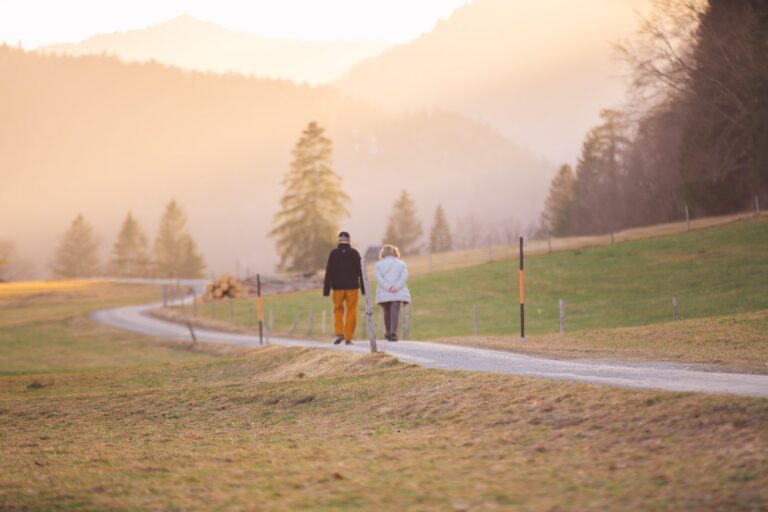 Senior couple on a long walk in the mountains